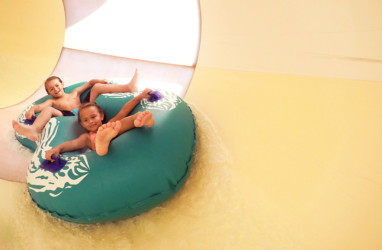 Brother and sister in the tube slide
