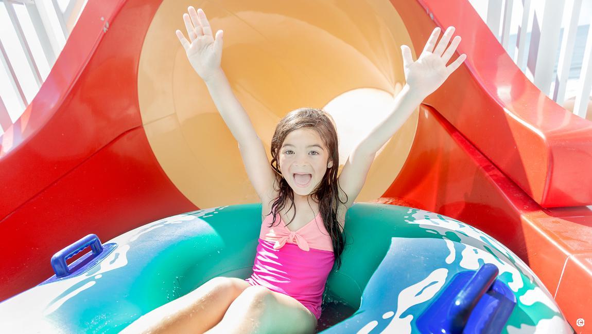 Girl getting ready to go down the slide at the waterpark