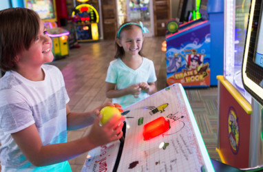 Kids playing at the arcade